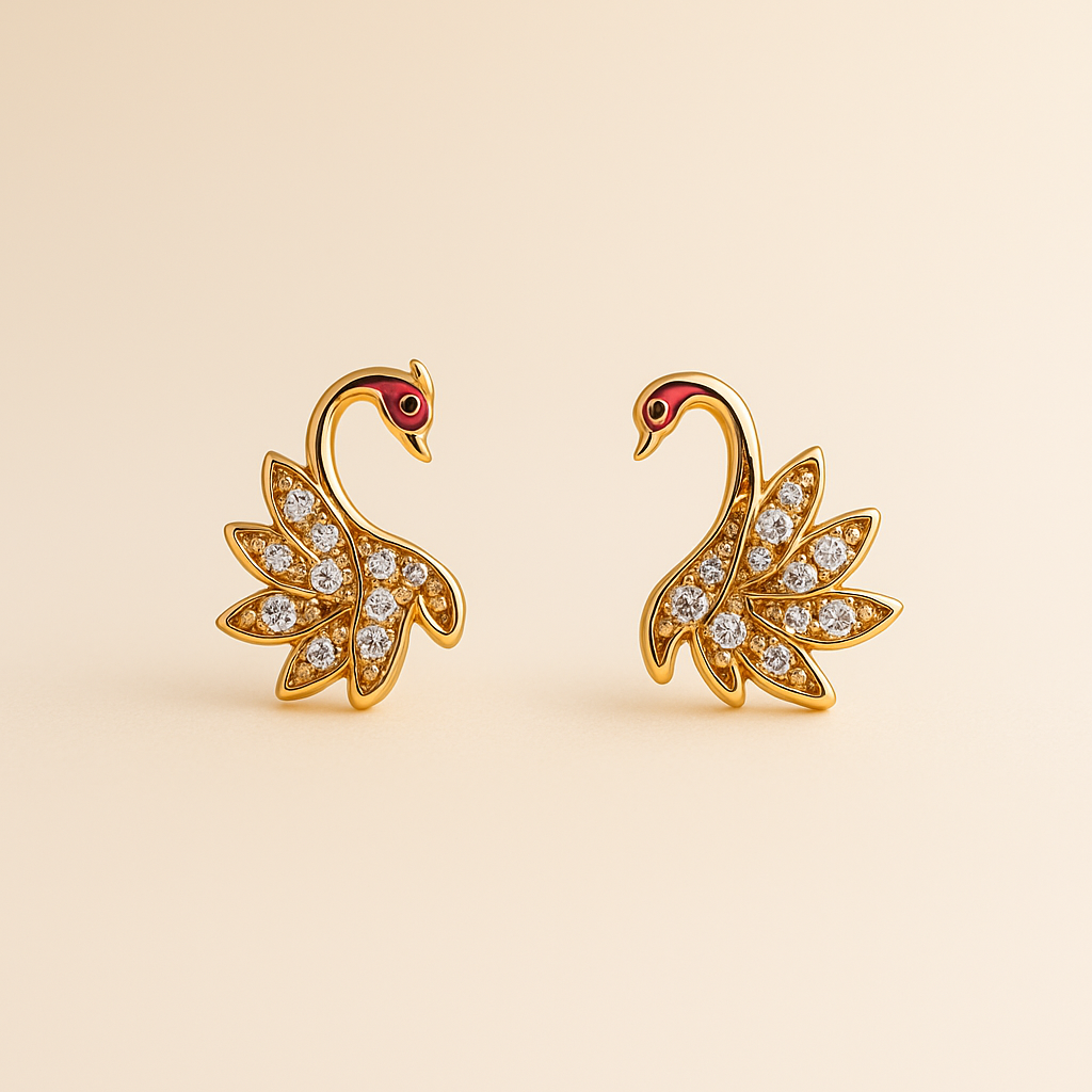 Gold swan earrings with gemstones on a beige background