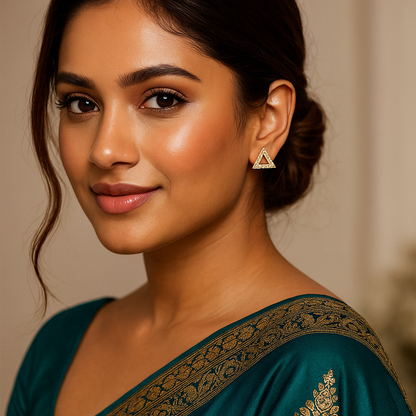 Woman wearing a green saree with Triangle shaped indian traditional stud earrings