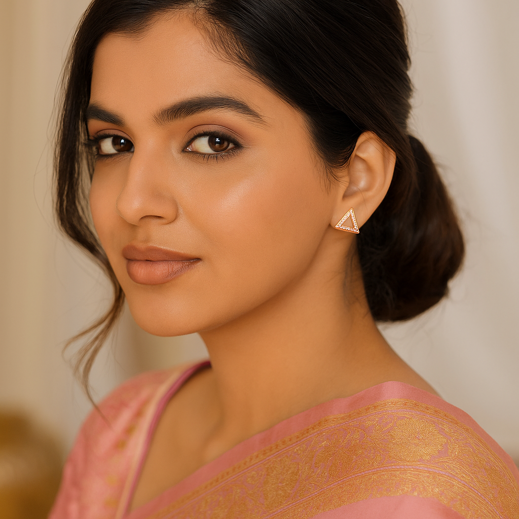 Woman wearing a pink and gold traditional outfit with a blurred background