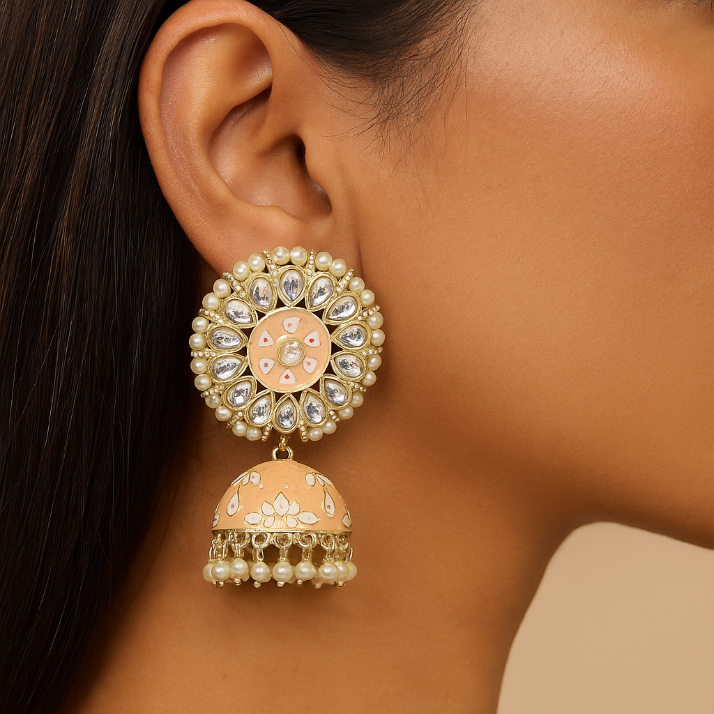 Close-up of a person wearing a decorative ethnic traditional indian pakistani earring with pearls and crystals.