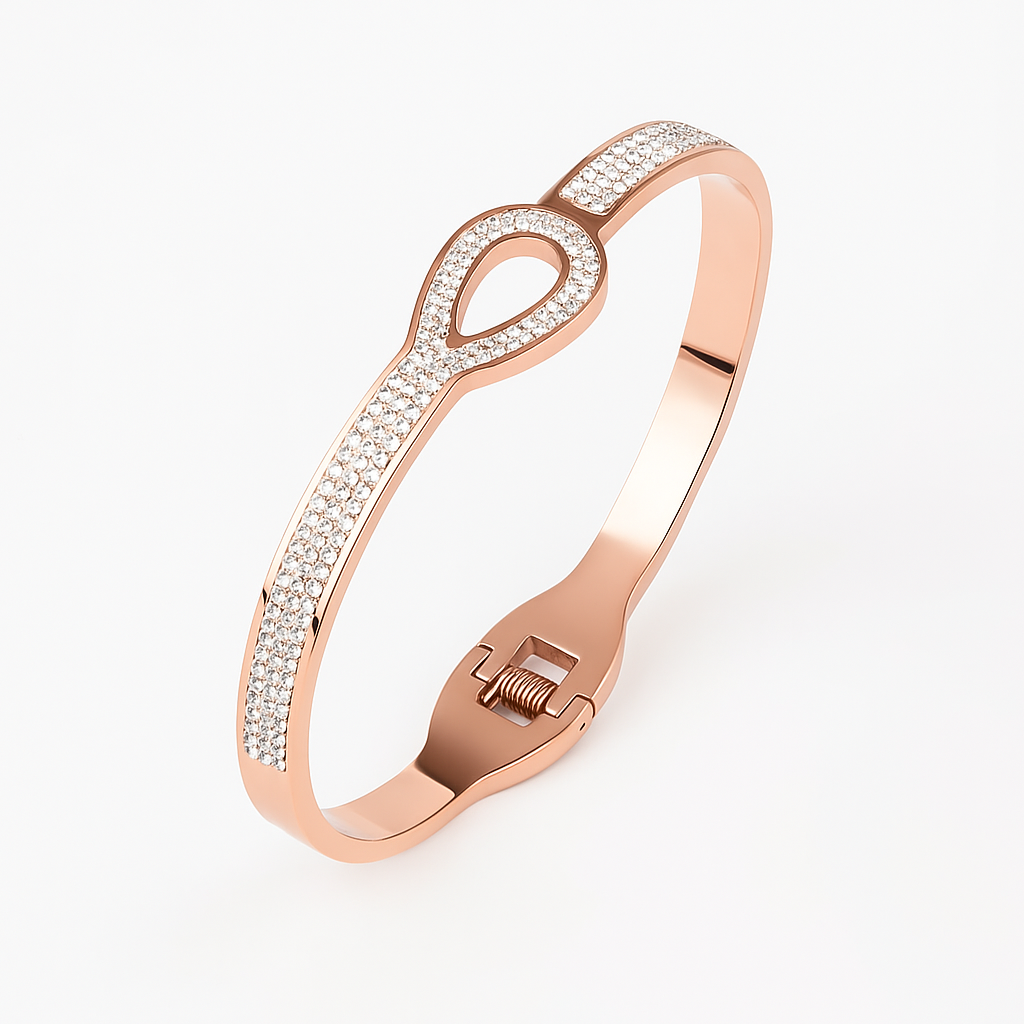 Rose gold bracelet with diamond accents on a white background
