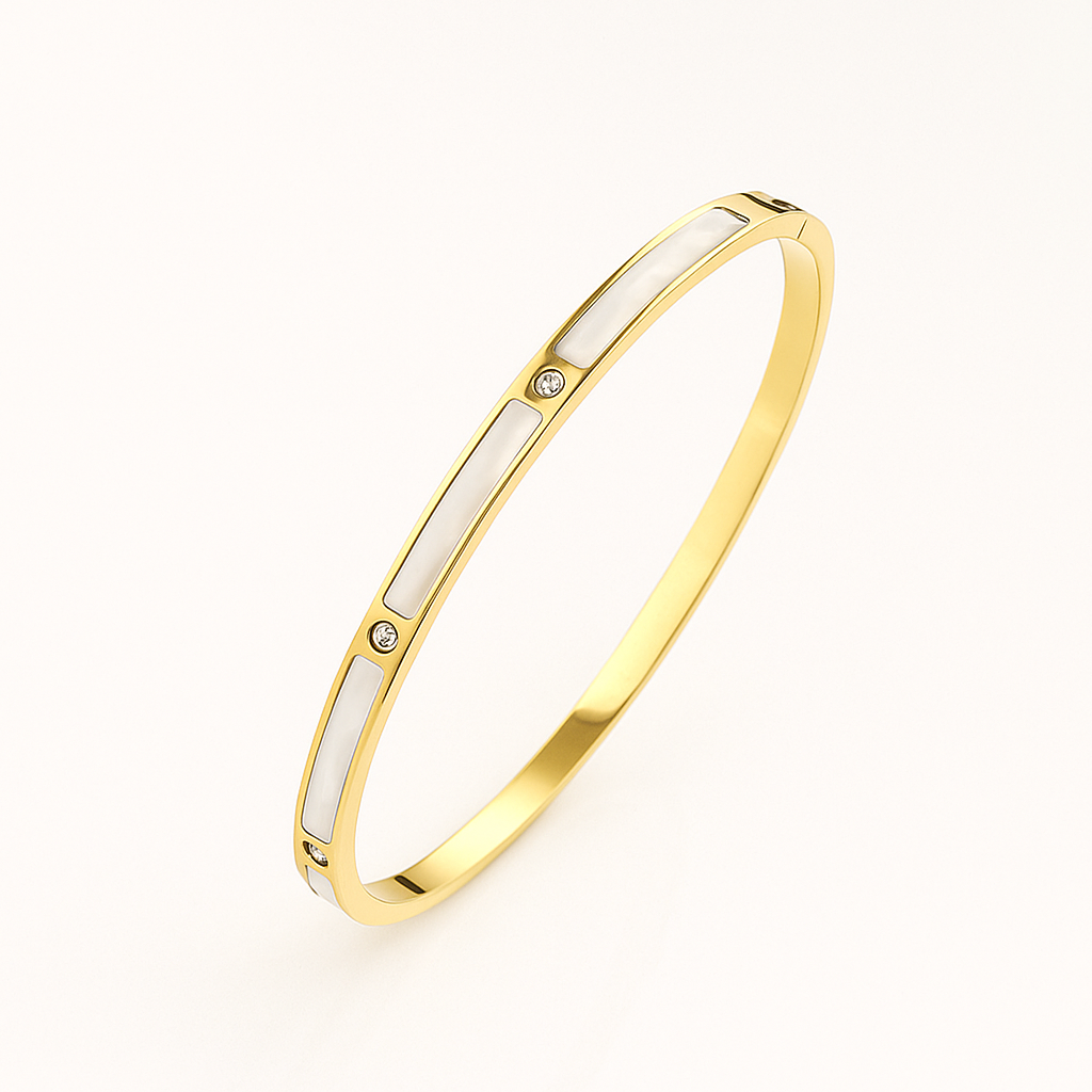 Gold and white bangle on a light beige background