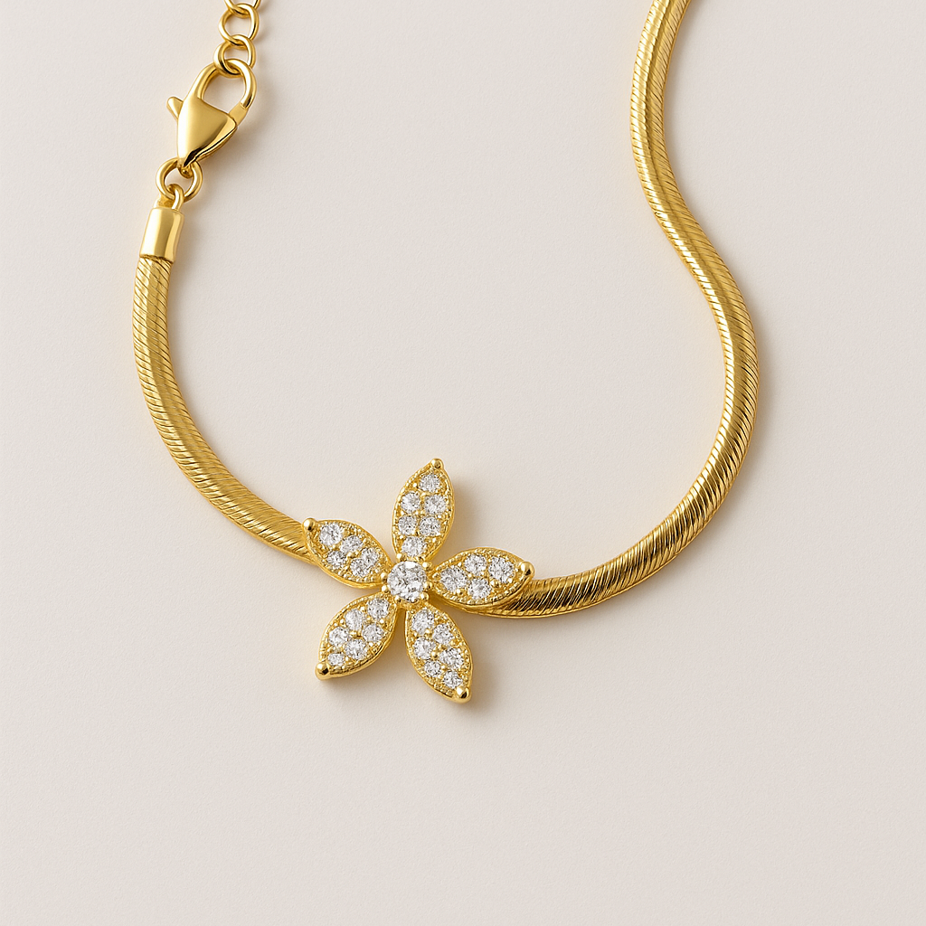 Gold necklace with a diamond leaf pendant on a beige background