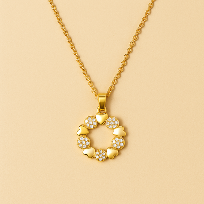 Gold necklace with a circular pendant on a beige background
