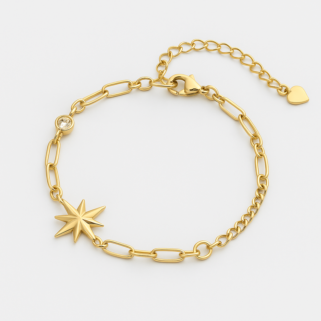 Gold bracelet with star charm on a light gray background