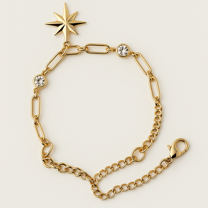 Gold bracelet with star-shaped clasp on a light beige background
