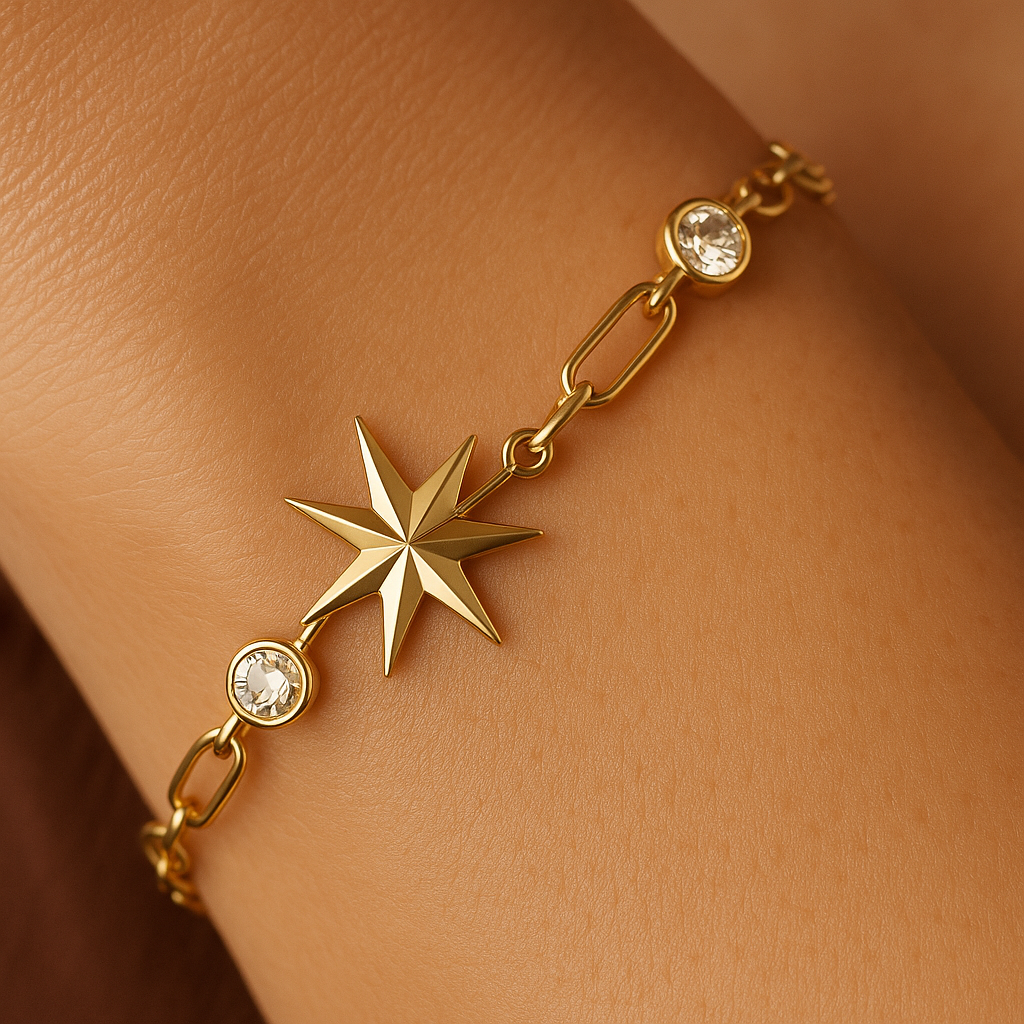 Gold bracelet with star design and clear stones on a wrist