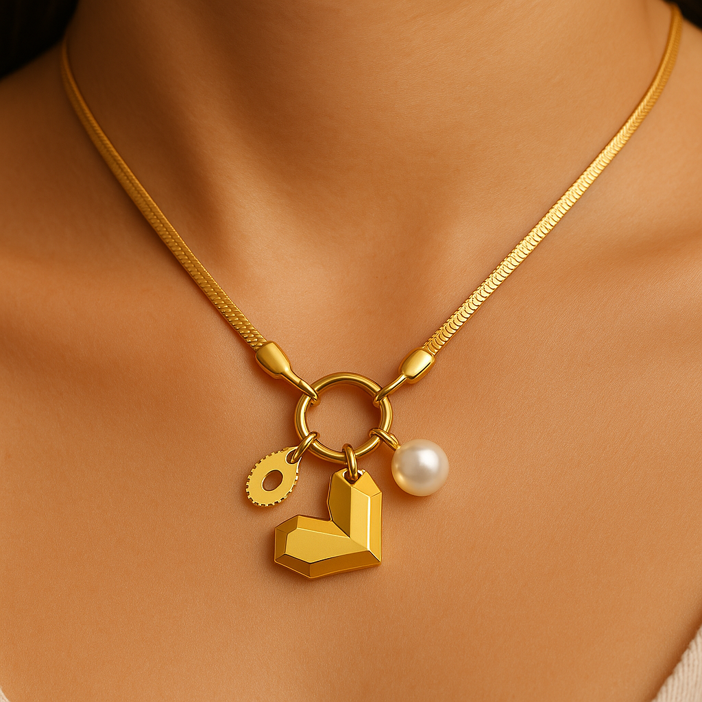 Gold necklace with heart and pearl charm on a person's neck