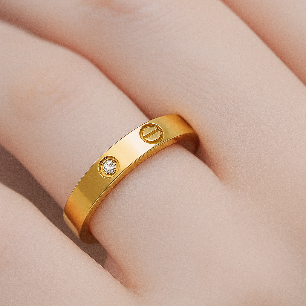 Gold ring with a diamond on a person's finger