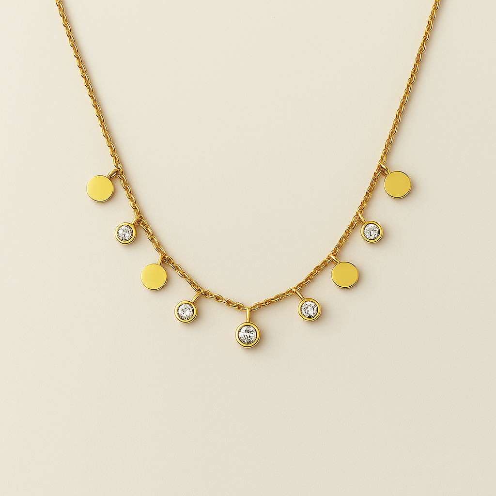 Gold necklace with round pendants and clear stones on a beige background