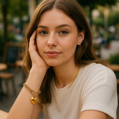 Woman wearing a gold necklace and bracelet with a blurred outdoor background
