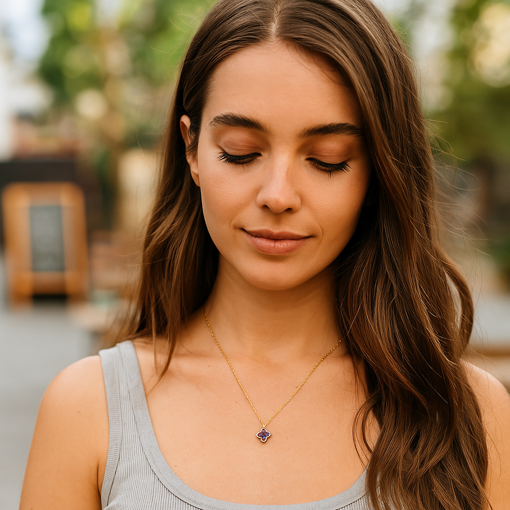 Woman wearing a necklace with a blurred outdoor background