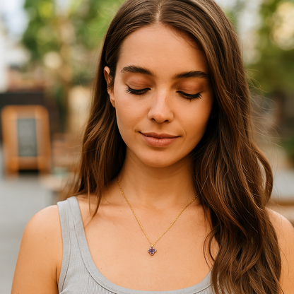 Woman wearing a necklace with a blurred outdoor background
