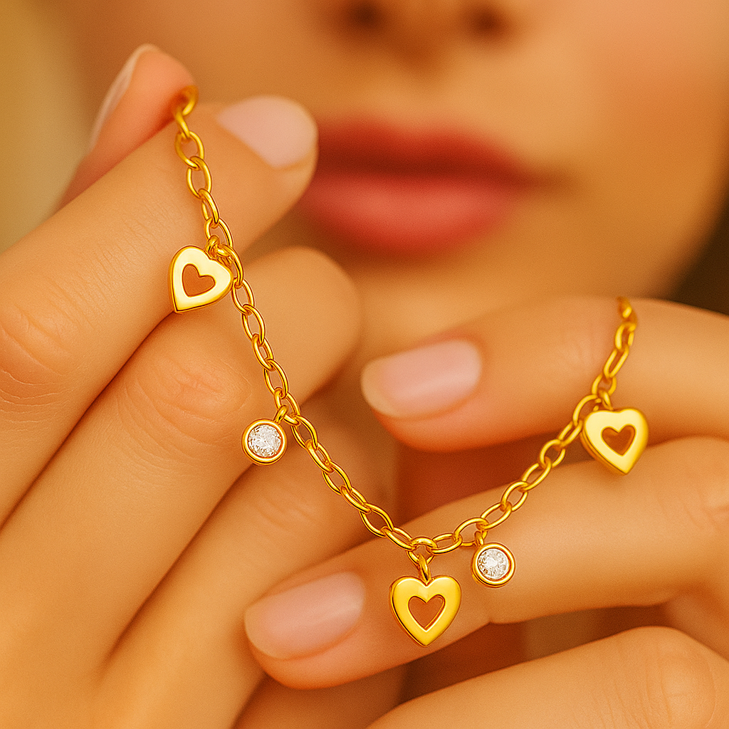Gold Bracelet with heart-shaped Charms held by a hand