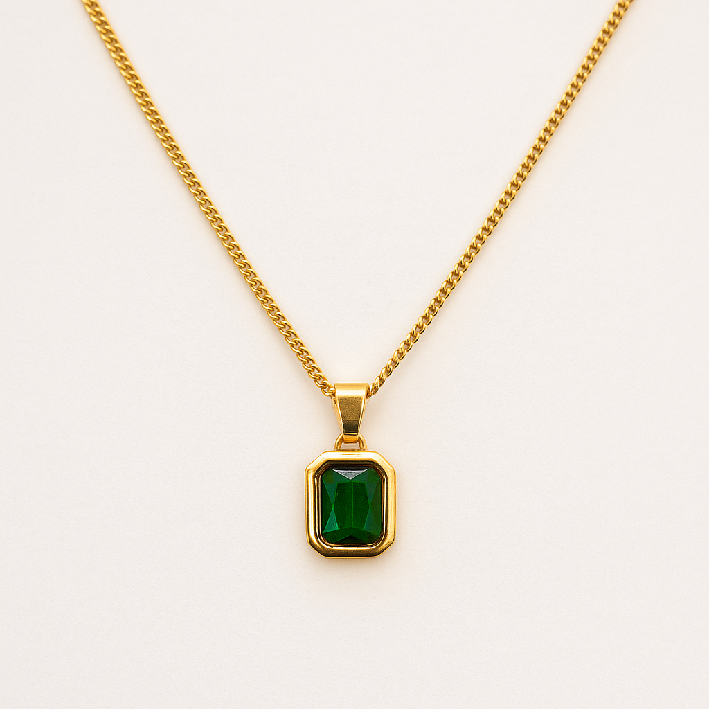 18K Gold necklace with a green gemstone pendant on a white background