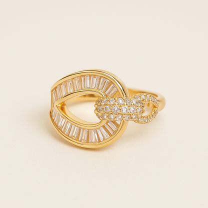 Gold ring with diamond accents on a beige background