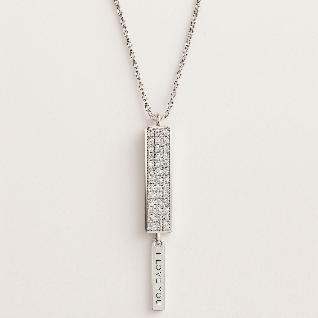 Silver necklace with a rectangular pendant and 'I LOVE YOU' tag on a light gray background