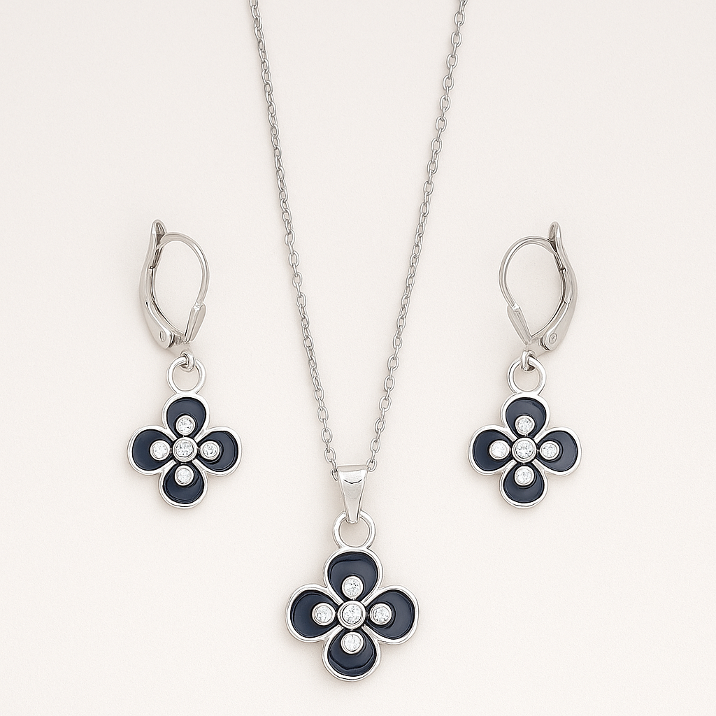 Jewelry set with floral pendant and earrings on a white background