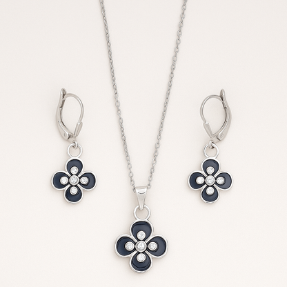 Jewelry set with floral pendant and earrings on a white background
