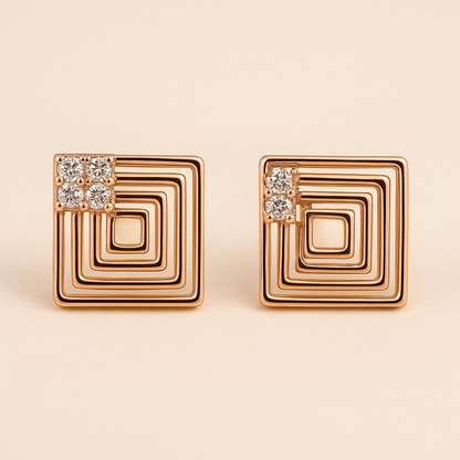Gold square earrings with diamond accents on a beige background