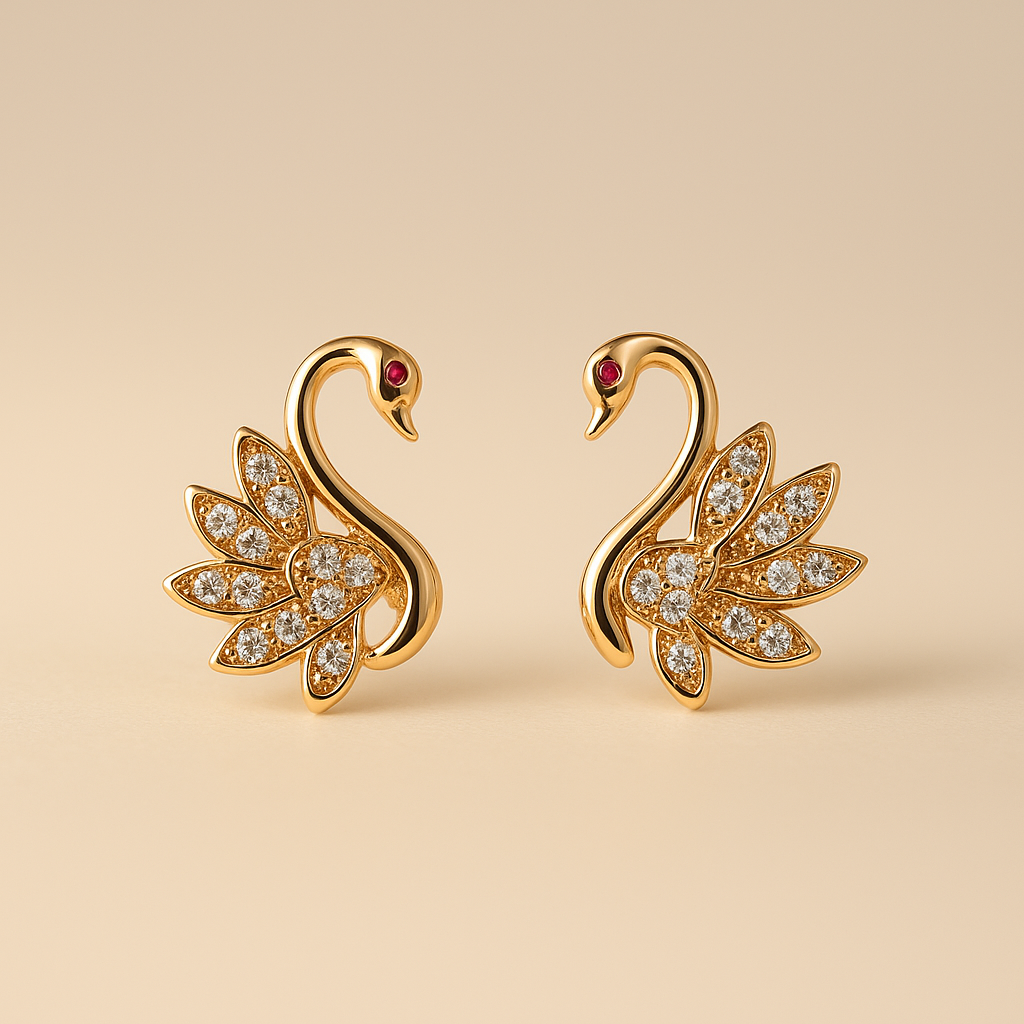 Gold swan earrings with gemstones on a beige background