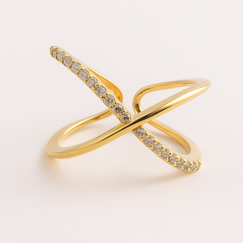 Gold ring with diamond accents on a light beige background
