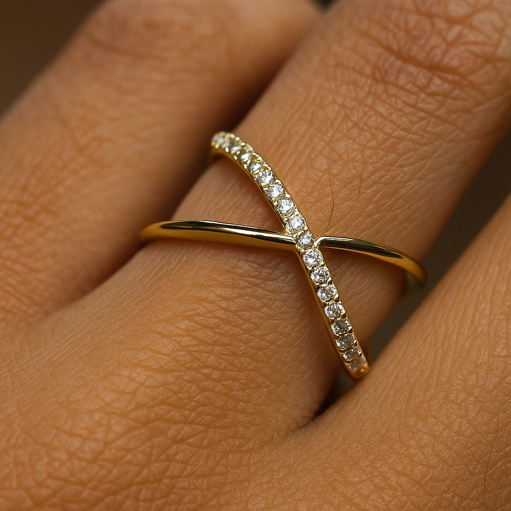 Gold ring with diamonds on a person's finger