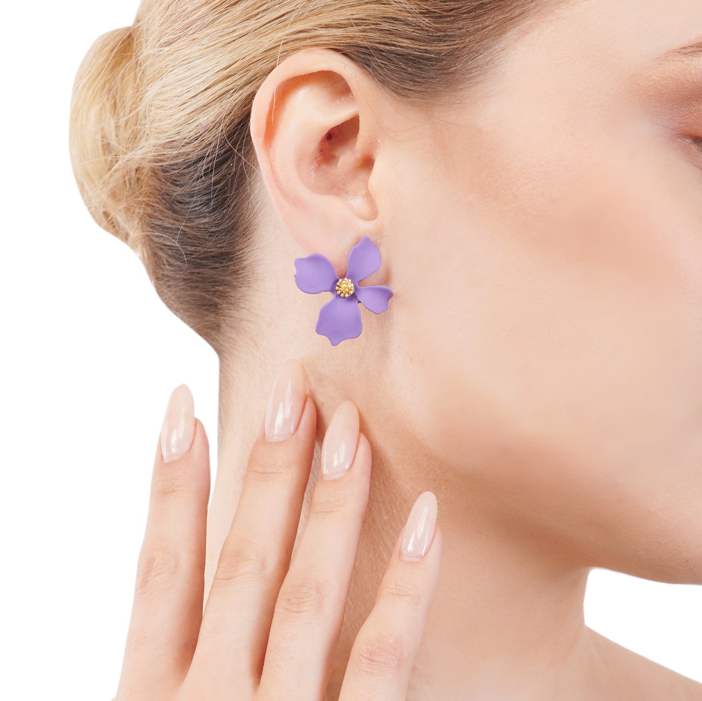 This image features an elegant purple flowery stud earring, showcased on a woman’s ear. The earring is designed with a simple yet captivating floral motif, rendered in a striking purple color with a central golden yellow motif, possibly representing the flower's core.