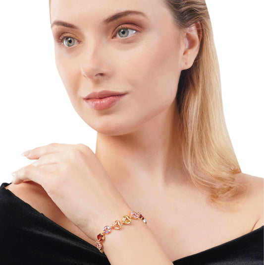 Woman wearing a colorful bracelet on a white background