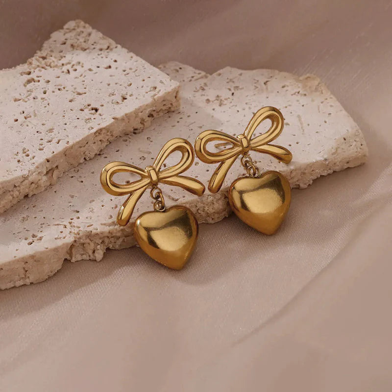 Heart and bo shaped 18K gold earrings