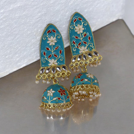 A pair of sky blue Meenakari earrings with gold detailing and pearl accents, displayed against a neutral background.
