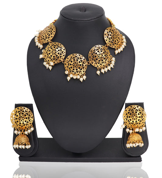 A mannequin showcasing a white and gold Punjabi choker set with intricate designs, consisting of a necklace and earrings.