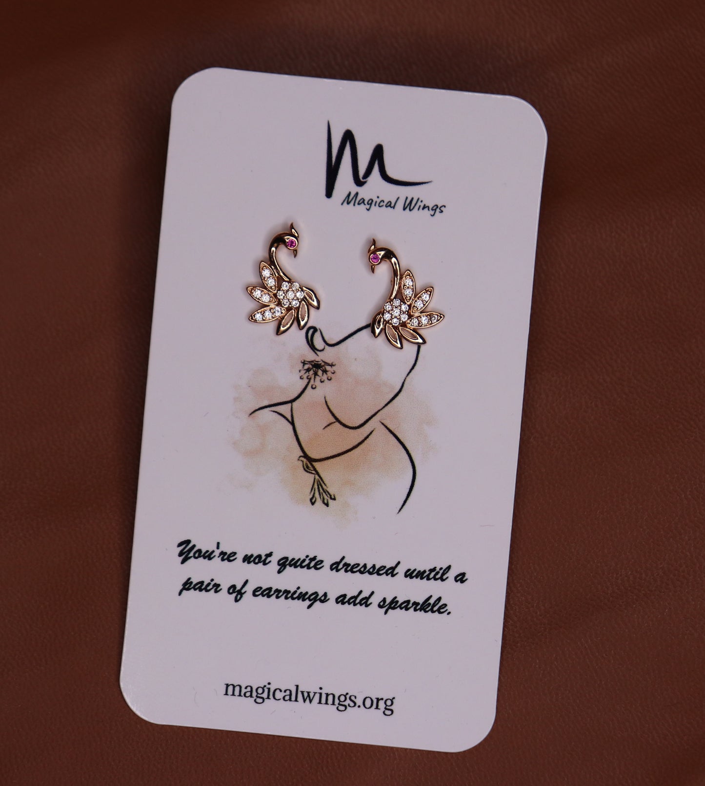 A pair of ethnic Indian style Butterfly stud earrings displayed on a card with the brand name Magical Wings.