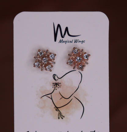 A pair of floral stud earrings with AD embellishments presented on a card with 'Magical Wings' branding.