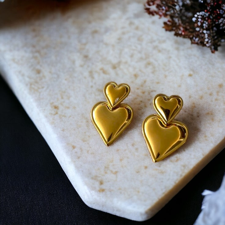 A pair of 18K heart shaped gold plated drop earring