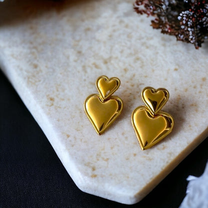 A pair of 18K heart shaped gold plated drop earring