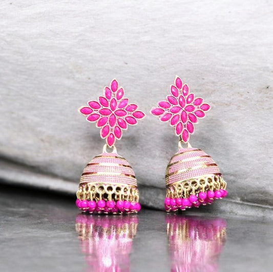 A pair of pink floral handcrafted coral earrings with a jhumka style, featuring gold-colored accents and beads.